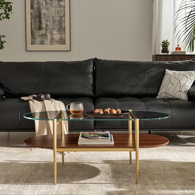 Shrine Oval Coffee Table, Mid-Century Modern Design, 2-Tier Structure, Clear Glass Top and Walnut MDF Shelf, 47" D x 21" W x 17" H, Sleek Conical Metal Legs with Gold Finish